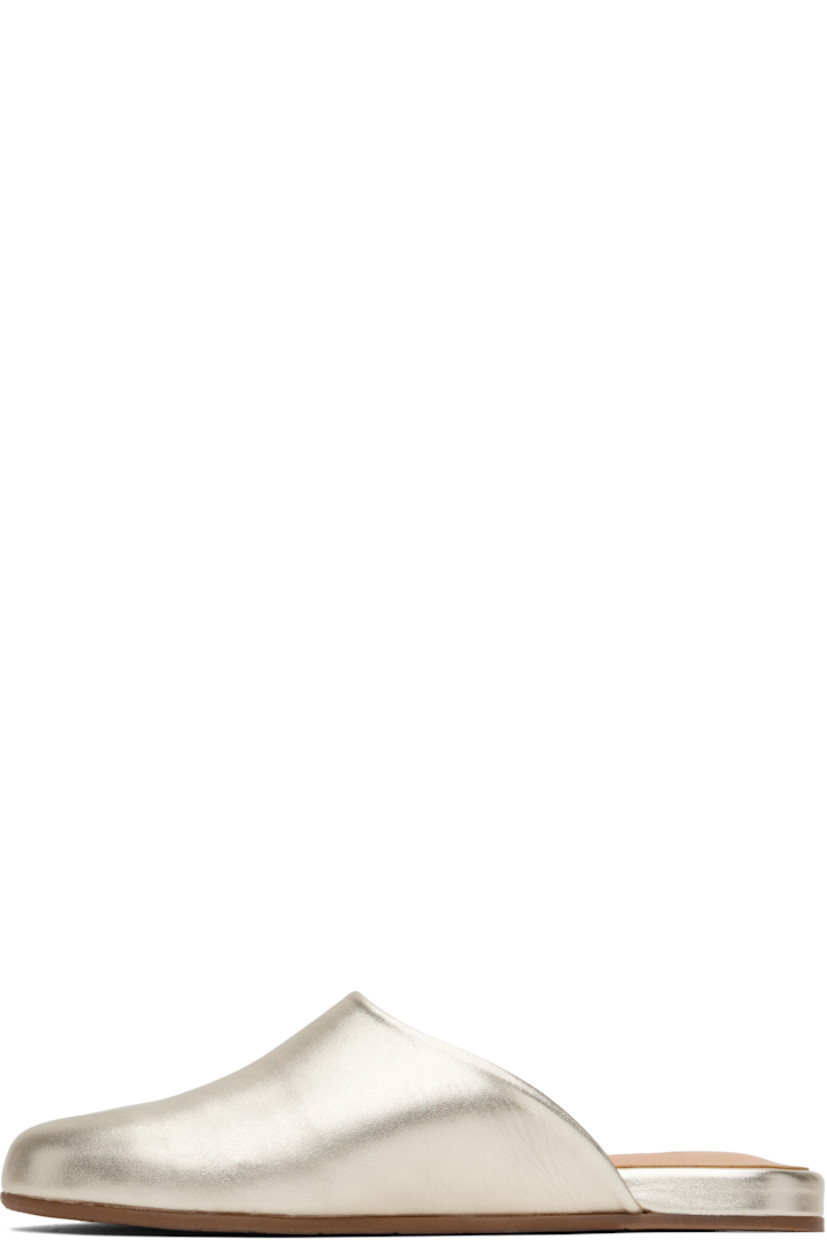 Handcrafted buffed nappa leather mules in metallic gold tone.

· Logo-embossed padded leather footbed
· Grained calfskin lining
· Logo-treaded rubber sole

Supplier color: Platinum