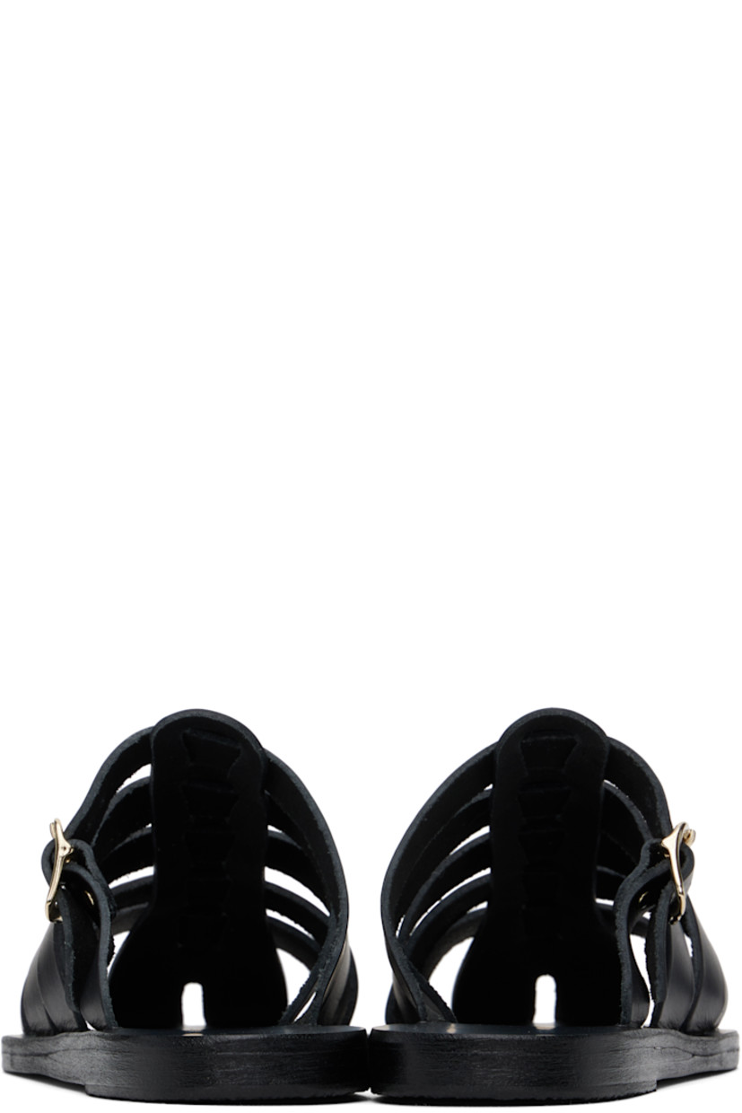 Handcrafted chemical-free buffed leather sandals in black.

· Cutouts throughout
· Pin-buckle strap at vamp
· Logo embossed at footbed
· Leather sole with rubber injection

Supplier color: Black