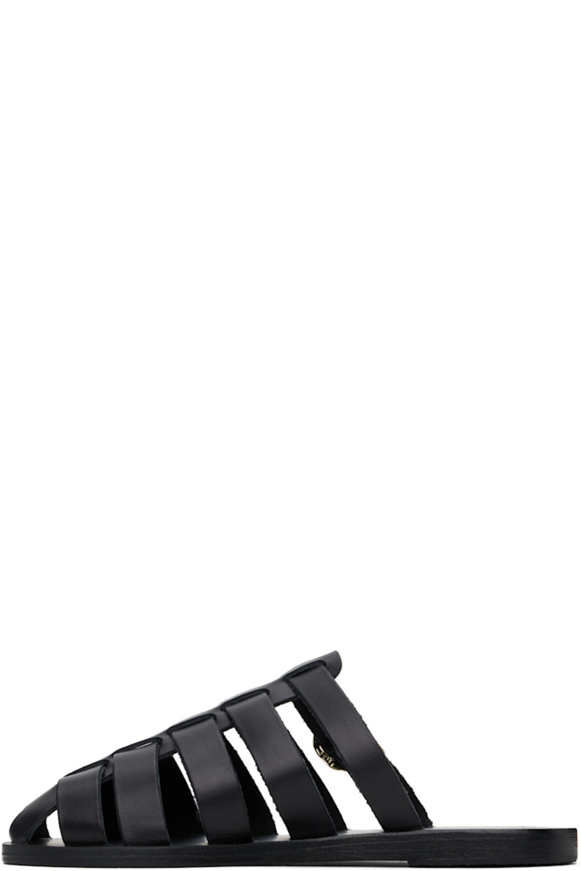 Handcrafted chemical-free buffed leather sandals in black.

· Cutouts throughout
· Pin-buckle strap at vamp
· Logo embossed at footbed
· Leather sole with rubber injection

Supplier color: Black