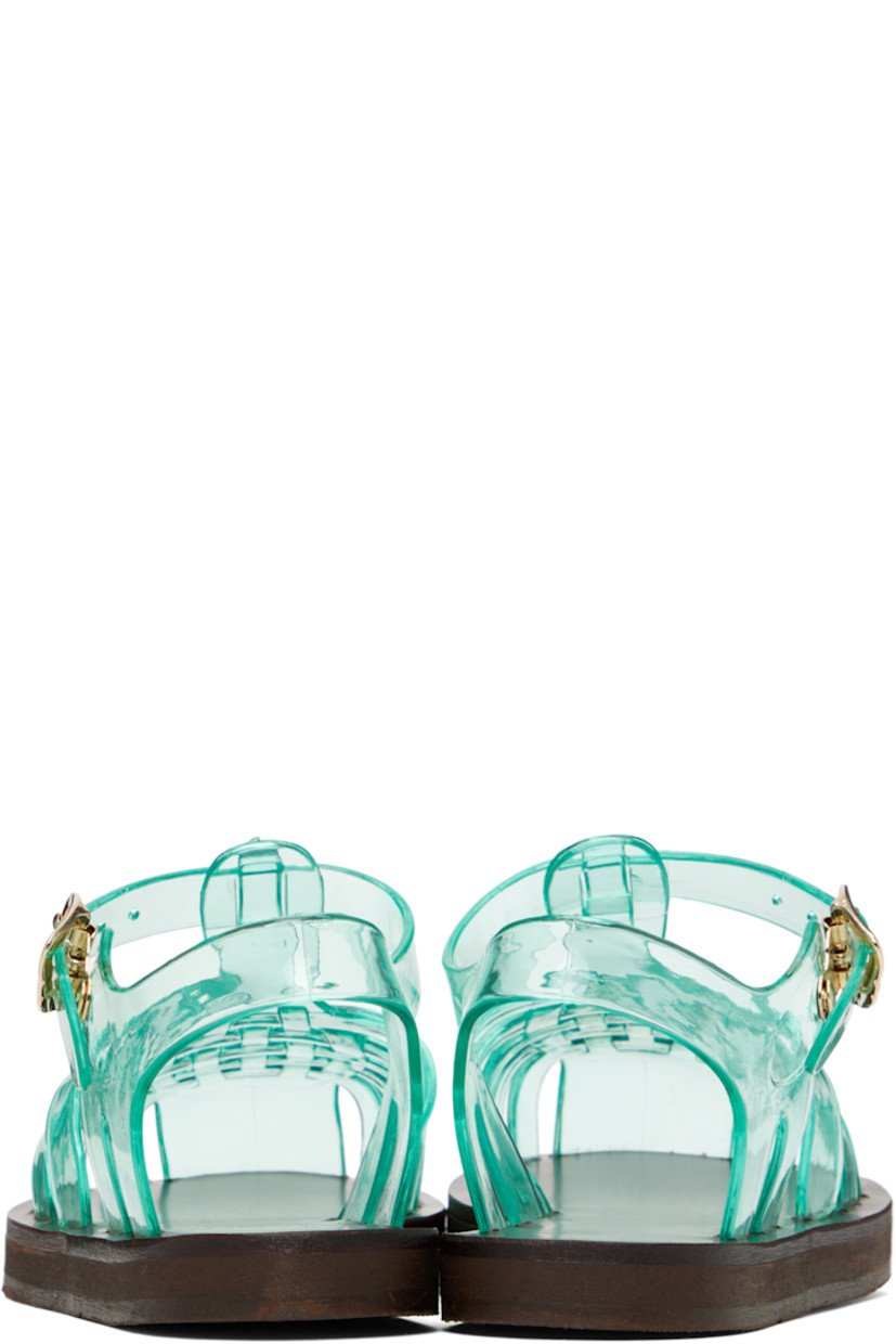Handcrafted transparent vinyl flat sandals in green.

· Cutouts throughout
· Logo hardware at pin-buckle ankle strap
· Hand-stitched stacked leather midsole
· Logo-embossed rubber sole

Supplier color: Clear aqua
