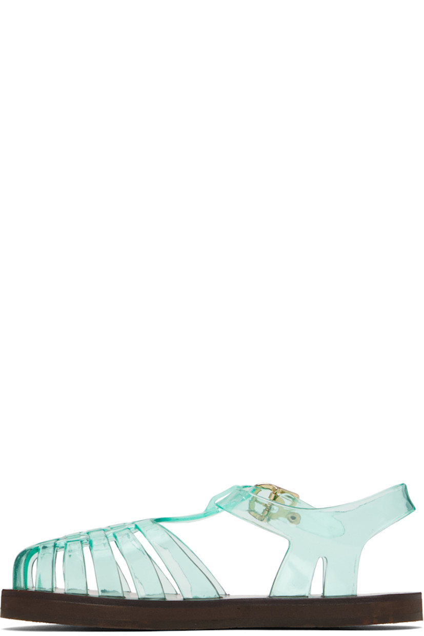 Handcrafted transparent vinyl flat sandals in green.

· Cutouts throughout
· Logo hardware at pin-buckle ankle strap
· Hand-stitched stacked leather midsole
· Logo-embossed rubber sole

Supplier color: Clear aqua