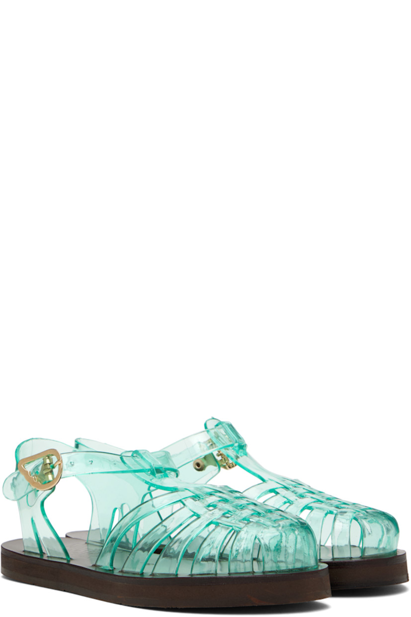 Handcrafted transparent vinyl flat sandals in green.

· Cutouts throughout
· Logo hardware at pin-buckle ankle strap
· Hand-stitched stacked leather midsole
· Logo-embossed rubber sole

Supplier color: Clear aqua