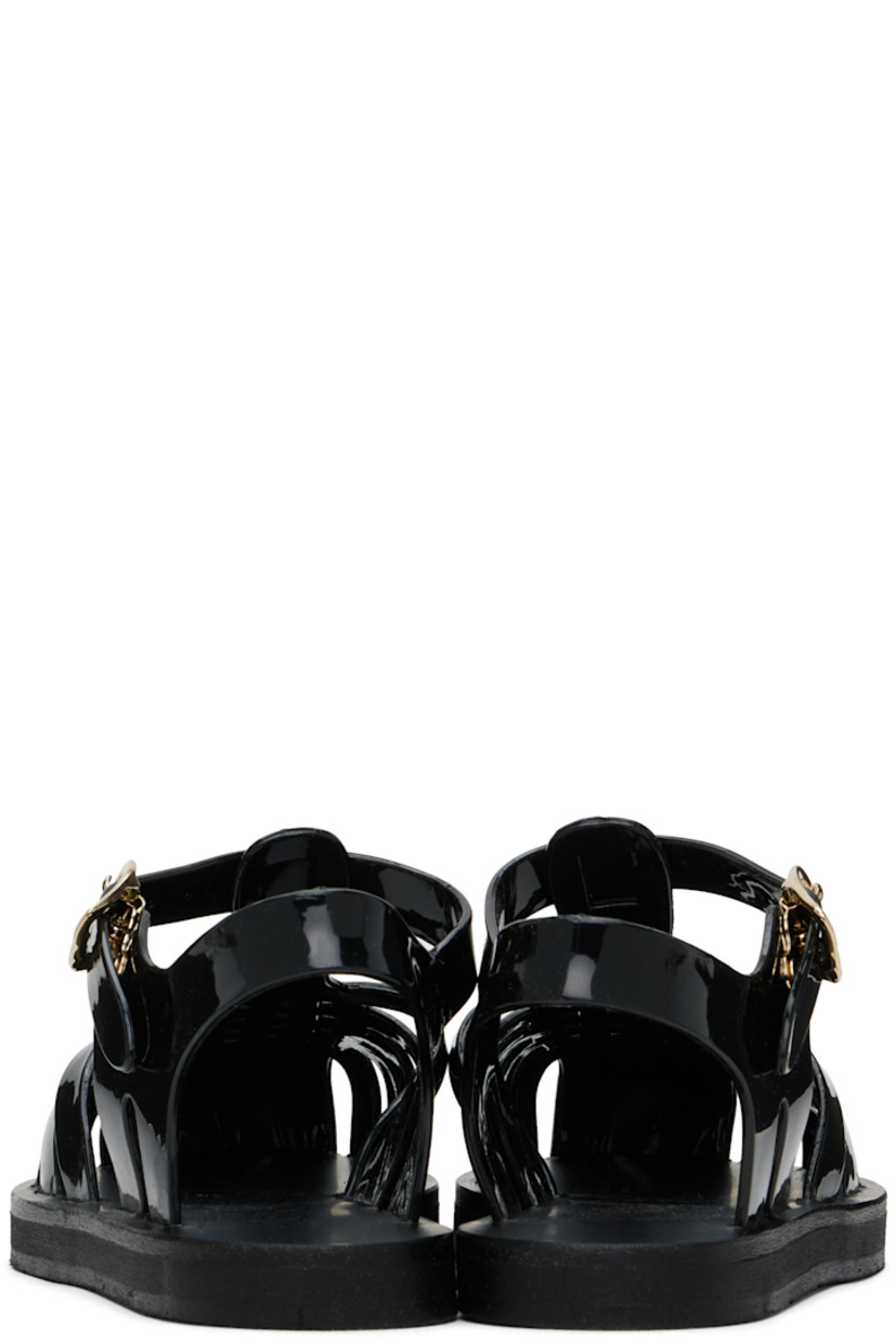 Handcrafted vinyl sandals in black.

· Cutouts throughout
· Pin-buckle ankle strap
· Logo embossed at footbed
· Treaded rubber sole

Supplier color: Black