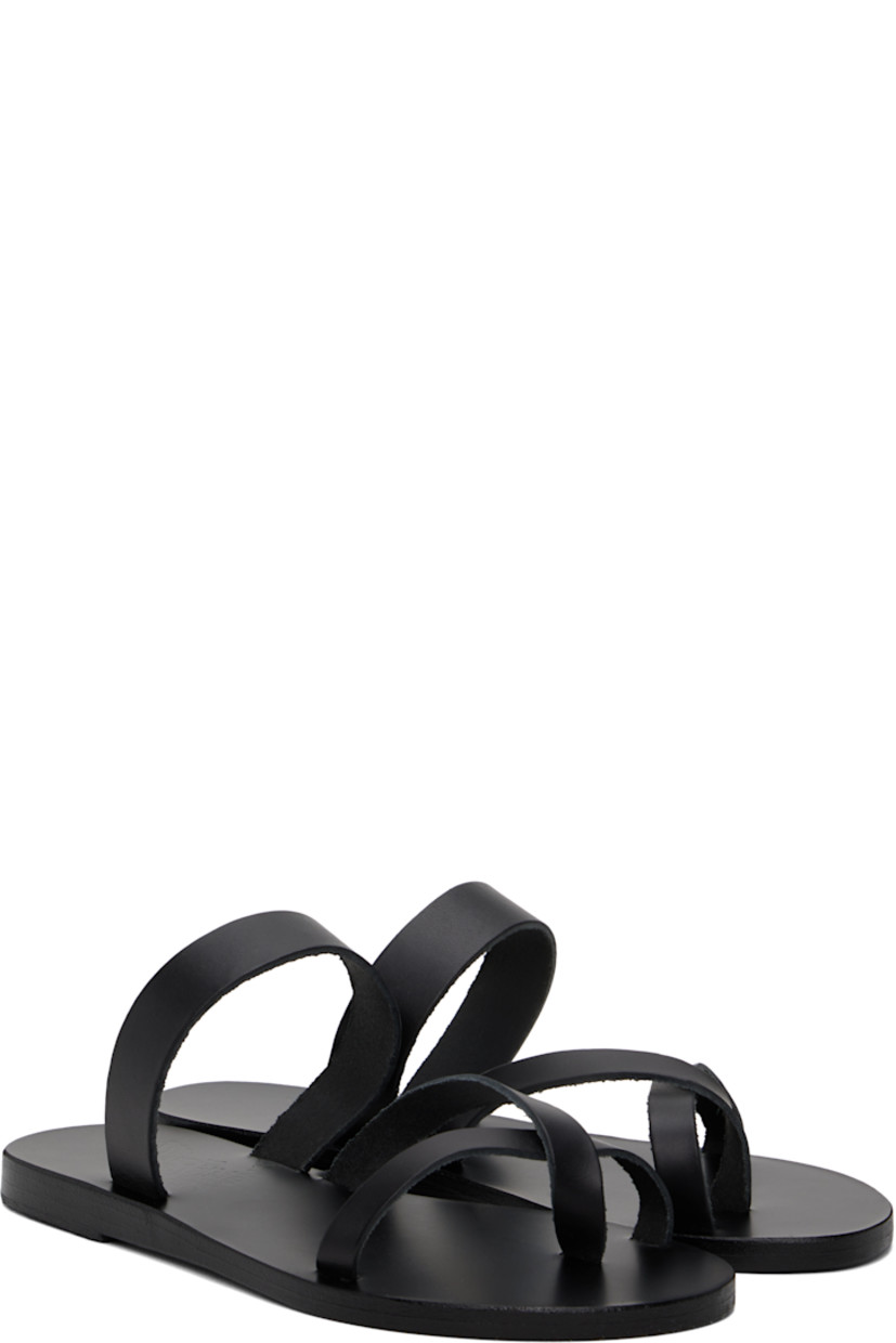 Handcrafted chemical-free buffed leather flat sandals in black.

· Raw edges throughout
· Open toe
· Fixed criss-crossing toe strap
· Logo embossed at leather footbed
· Textured rubber heel
· Leather sole

Supplier color: Black