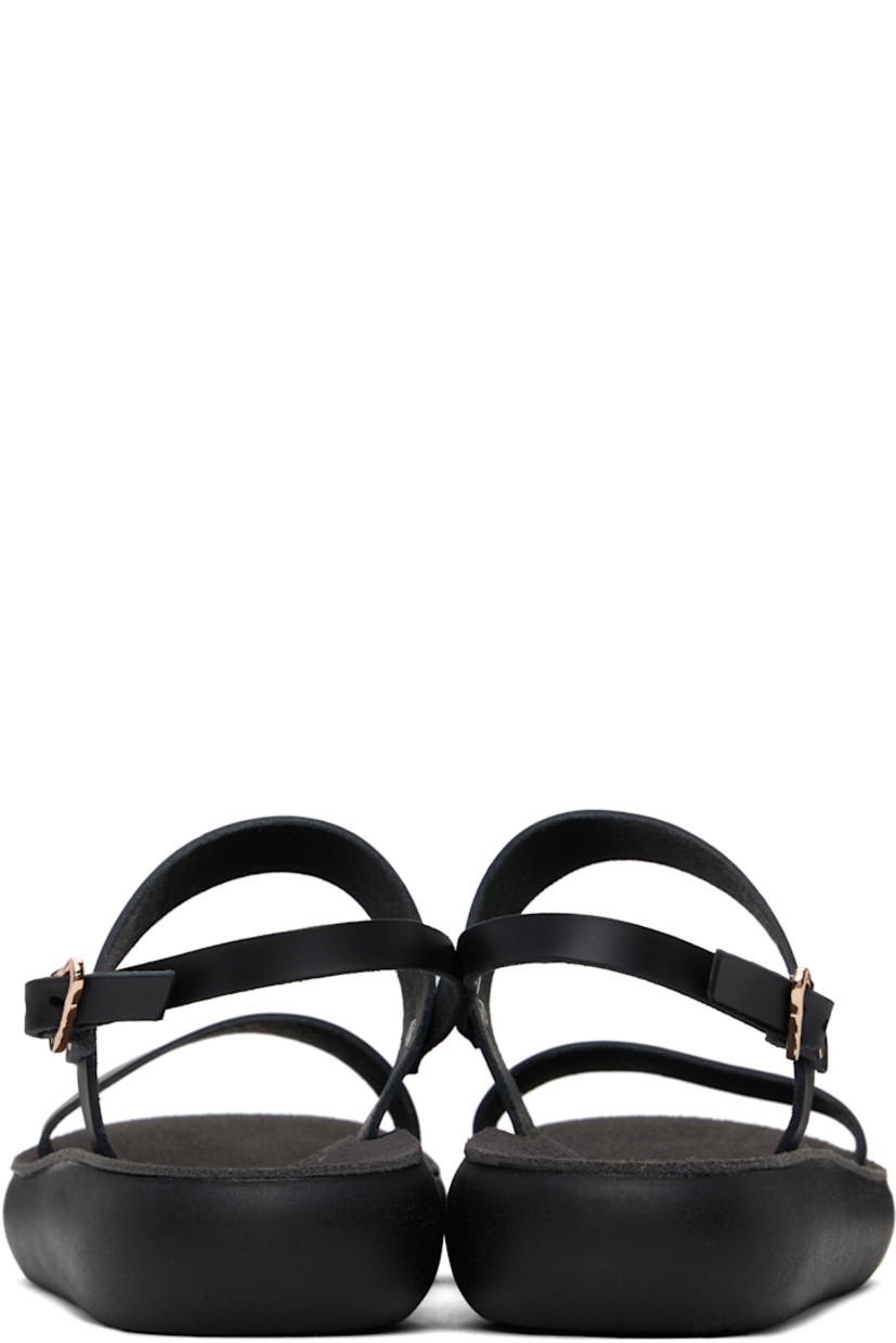Handcrafted chemical-free buffed leather flat sandals in black.

· Raw edges throughout
· Open toe
· Pin-buckle ankle strap
· Logo embossed at padded suede footbed
· Logo-embossed rubber sole

Supplier color: Black