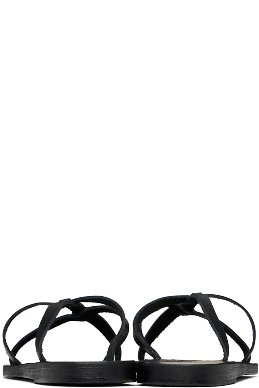 Handcrafted chemical-free buffed leather flat sandals in black.

· Open toe
· Sliding crisscrossing straps at vamp
· Logo embossed at footbed
· Stacked leather sole with rubber injection

Supplier color: Black