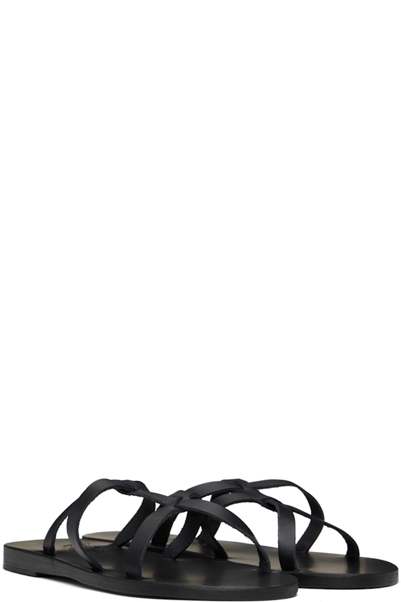 Handcrafted chemical-free buffed leather flat sandals in black.

· Open toe
· Sliding crisscrossing straps at vamp
· Logo embossed at footbed
· Stacked leather sole with rubber injection

Supplier color: Black