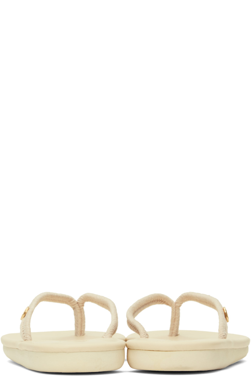 Handcrafted braided cord flip-flops in beige.

· Open toe
· Logo hardware at thong-style strap
· Logo embossed at padded leather footbed
· Treaded rubber sole

Supplier color: Beige
