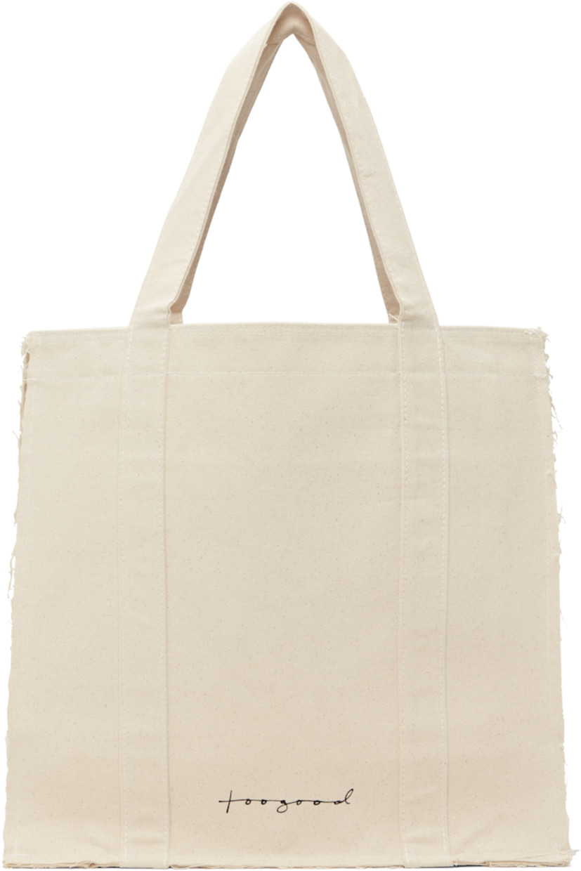 Nep cotton canvas tote in beige.

· Frayed edges throughout
· Fixed shoulder straps
· Logo printed at face
· Press-stud closure
· Zip pocket at interior
· Laptop compartment
· H17" x W18" x D8"

Supplier color: Raw