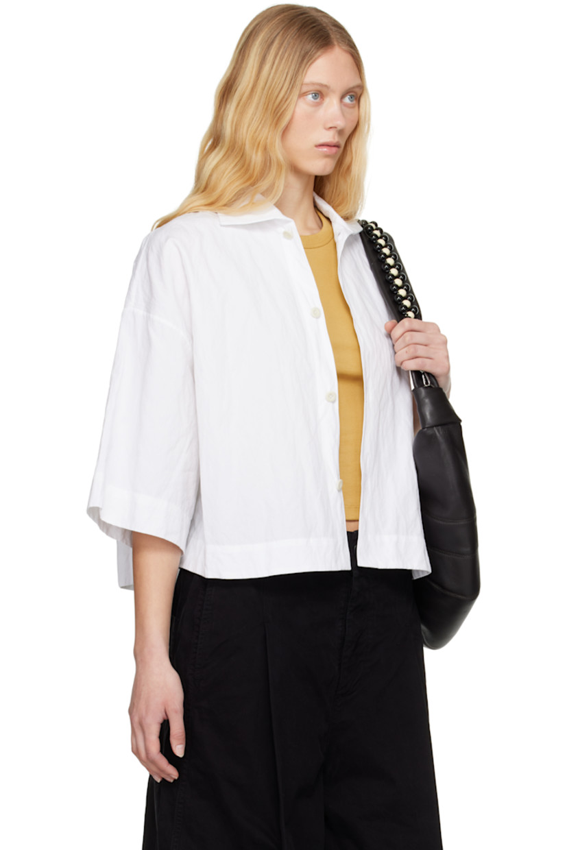 Boxy-fit crinkled cotton-blend poplin shirt.

· Spread collar
· Button closure
· Cropped hem
· Vented side seams
· Dropped shoulders

Supplier color: Chalk