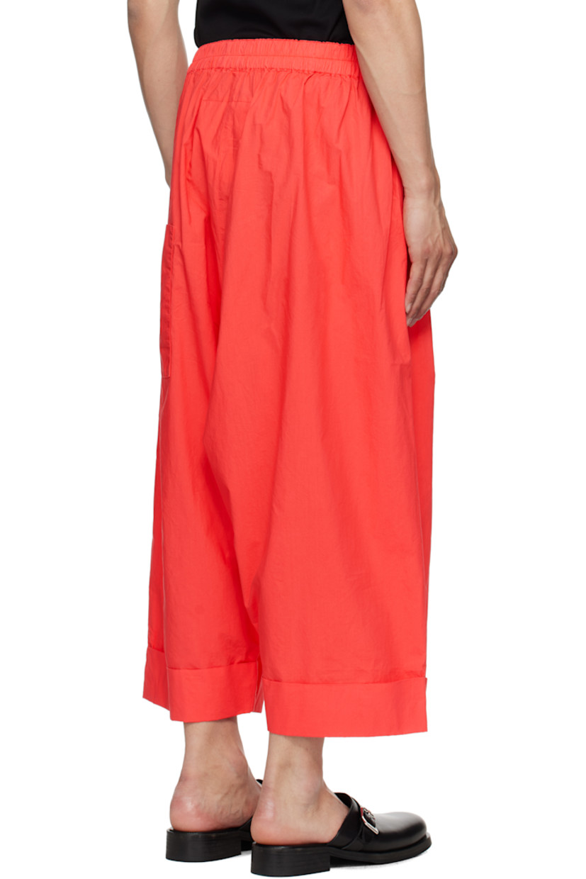 Wide-leg cotton poplin trousers.

· Lightweight and garment-dyed
· Concealed drawstring at elasticized waistband
· Three-pocket styling
· Pleats at front
· Cropped legs
· Rolled cuffs

Supplier color: Tomato