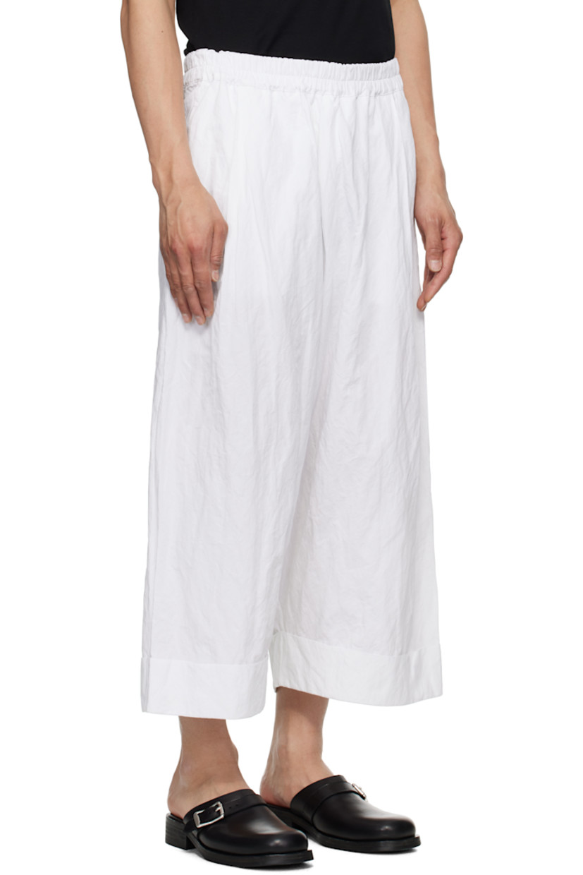 Crinkled cotton-blend poplin trousers. 

· Concealed drawstring at elasticized waistband
· Three-pocket styling
· Pleats at front 
· Cropped legs
· Rolled cuffs

Supplier color: Chalk