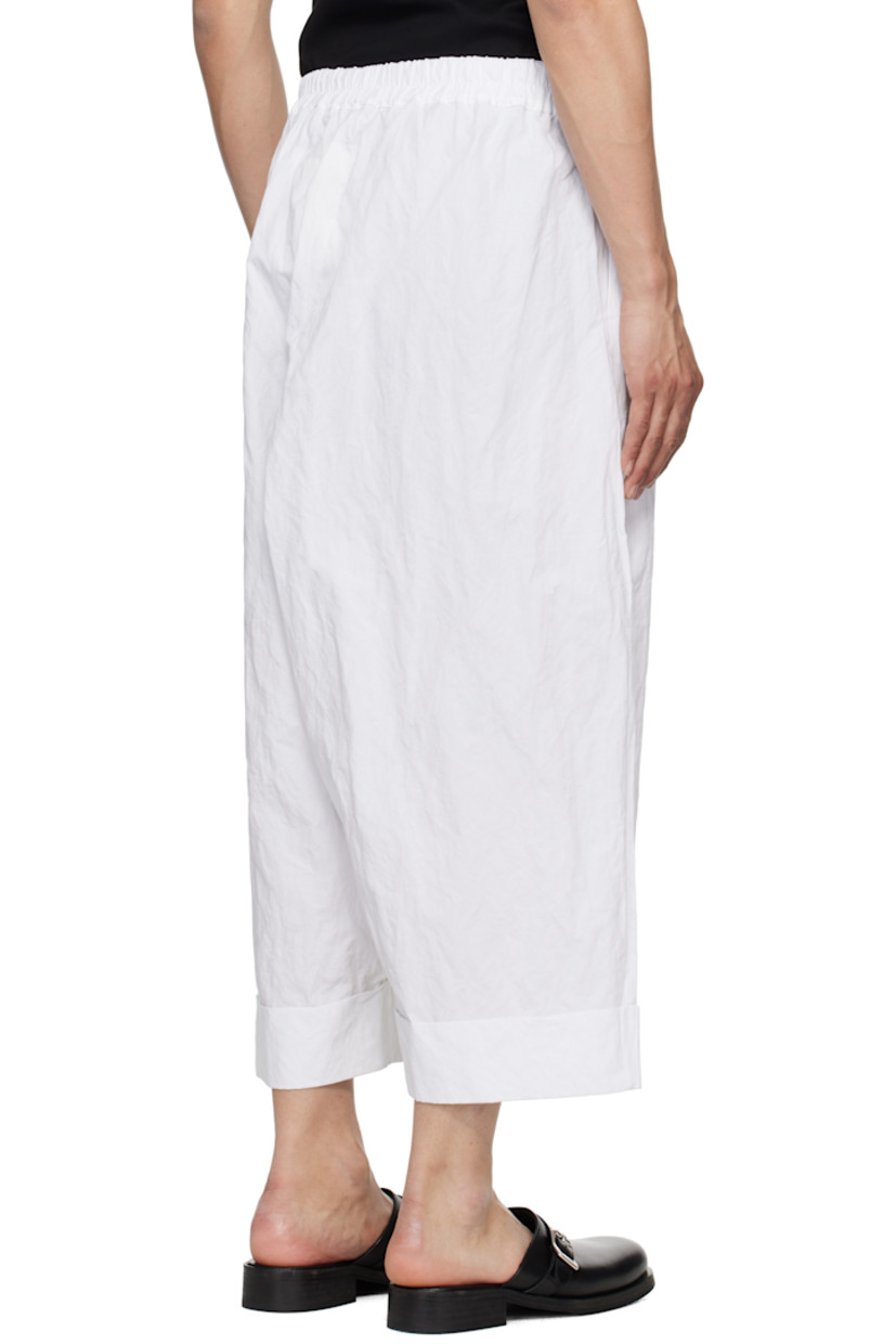 Crinkled cotton-blend poplin trousers. 

· Concealed drawstring at elasticized waistband
· Three-pocket styling
· Pleats at front 
· Cropped legs
· Rolled cuffs

Supplier color: Chalk
