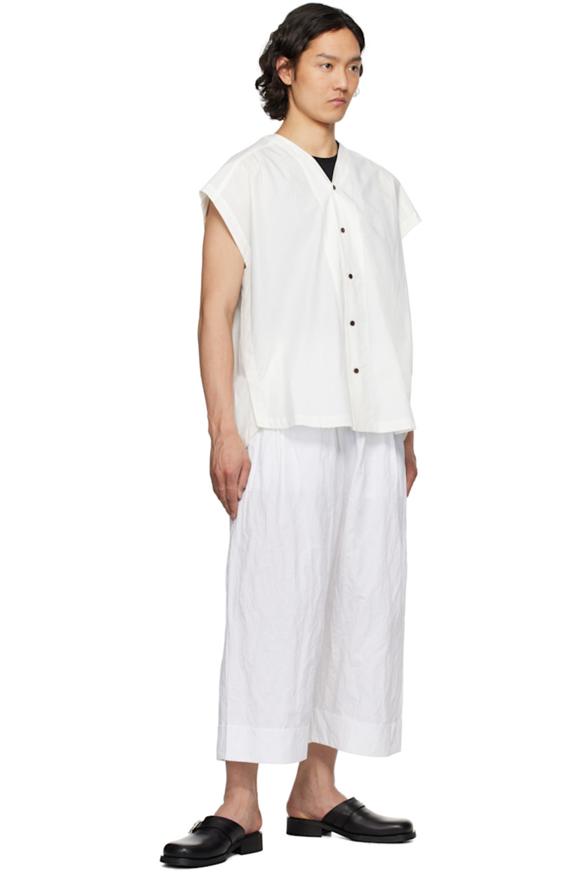 Crinkled cotton-blend poplin trousers. 

· Concealed drawstring at elasticized waistband
· Three-pocket styling
· Pleats at front 
· Cropped legs
· Rolled cuffs

Supplier color: Chalk
