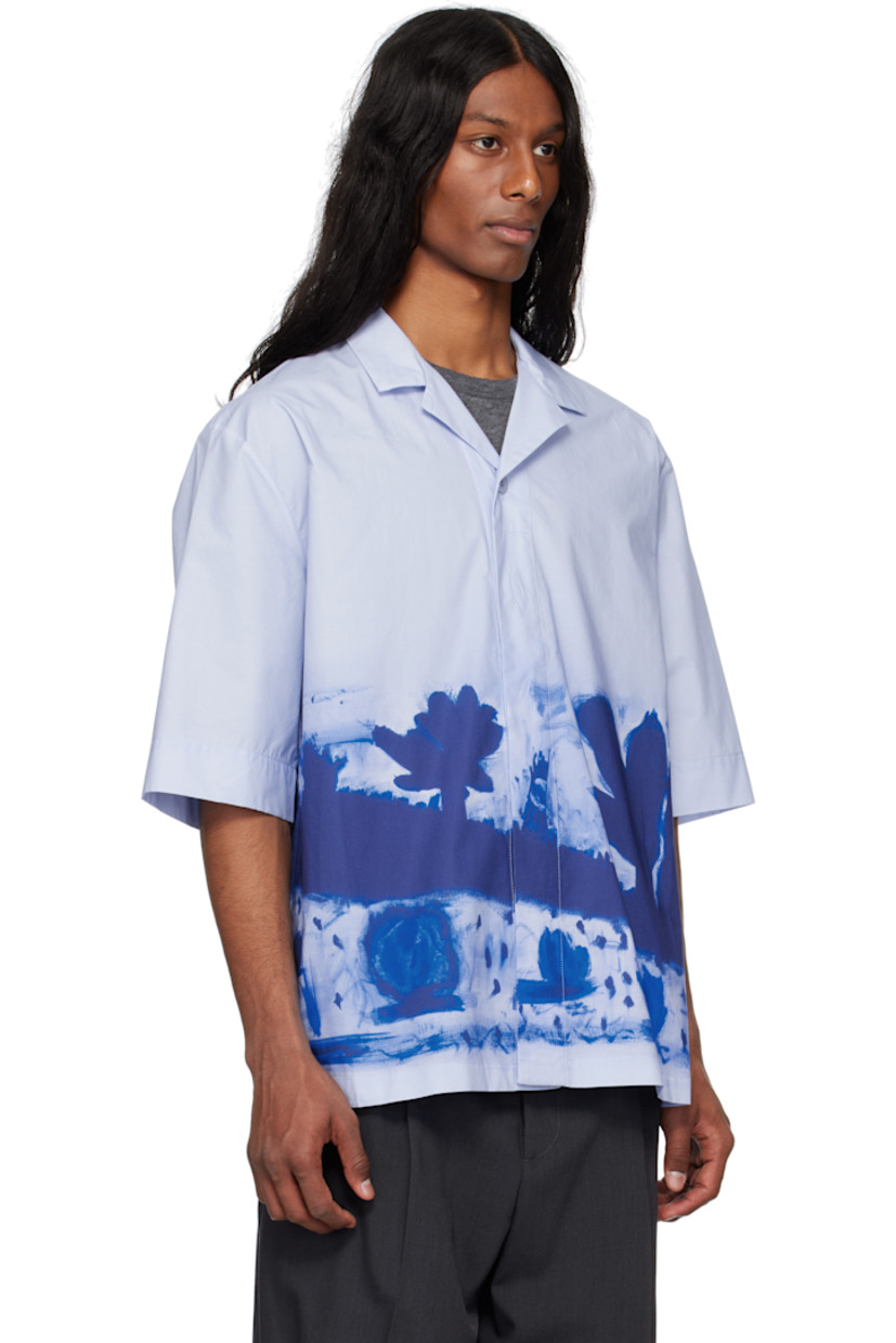 Cotton poplin shirt. Graphic pattern printed throughout.

· Open spread collar
· Concealed button closure
· Dropped shoulders

Supplier color: Apron