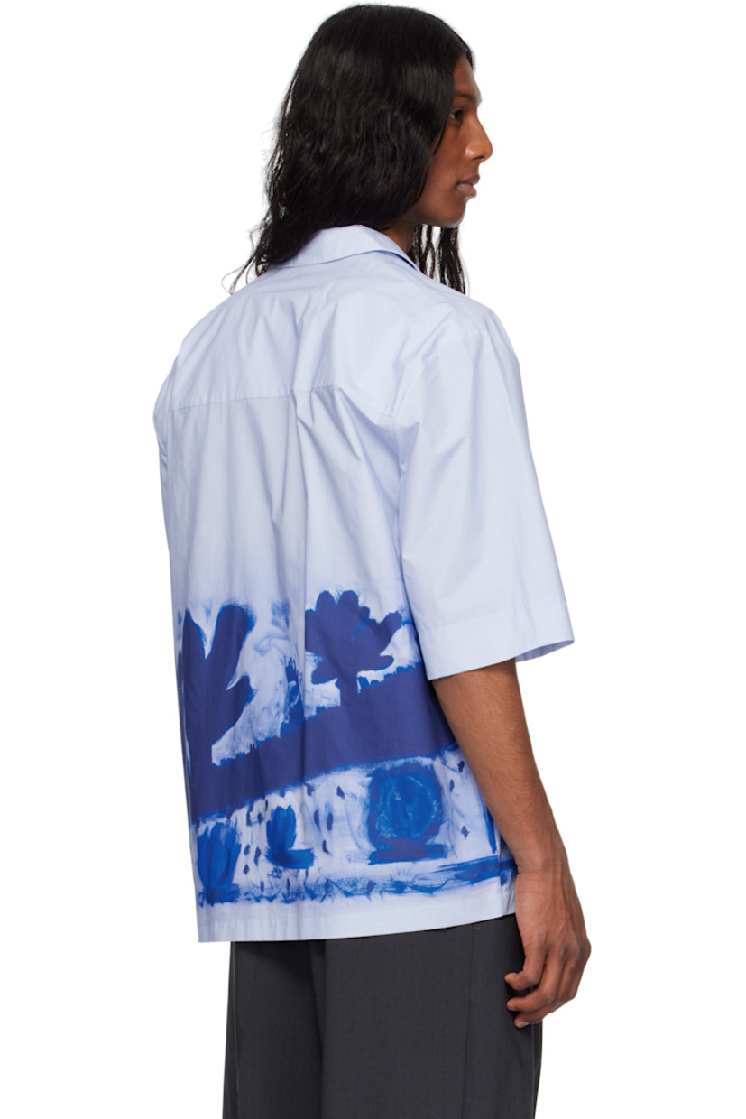 Cotton poplin shirt. Graphic pattern printed throughout.

· Open spread collar
· Concealed button closure
· Dropped shoulders

Supplier color: Apron
