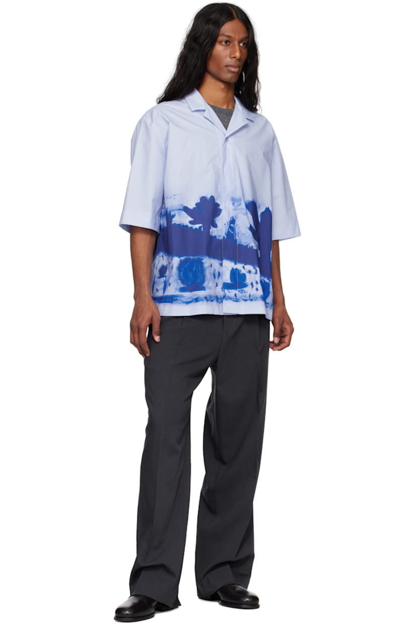 Cotton poplin shirt. Graphic pattern printed throughout.

· Open spread collar
· Concealed button closure
· Dropped shoulders

Supplier color: Apron