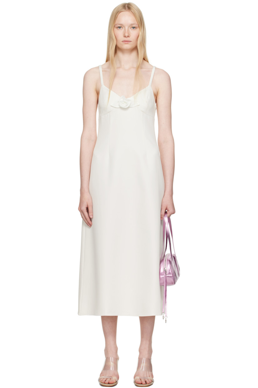 Stretch polyester broadcloth midi dress. 

· V-neck
· Floral appliqué at chest
· Darts at front
· Flared hem
· Concealed zip closure at side
· Elasticized trim at low back
· Partial viscose twill lining

Supplier color: Ivory