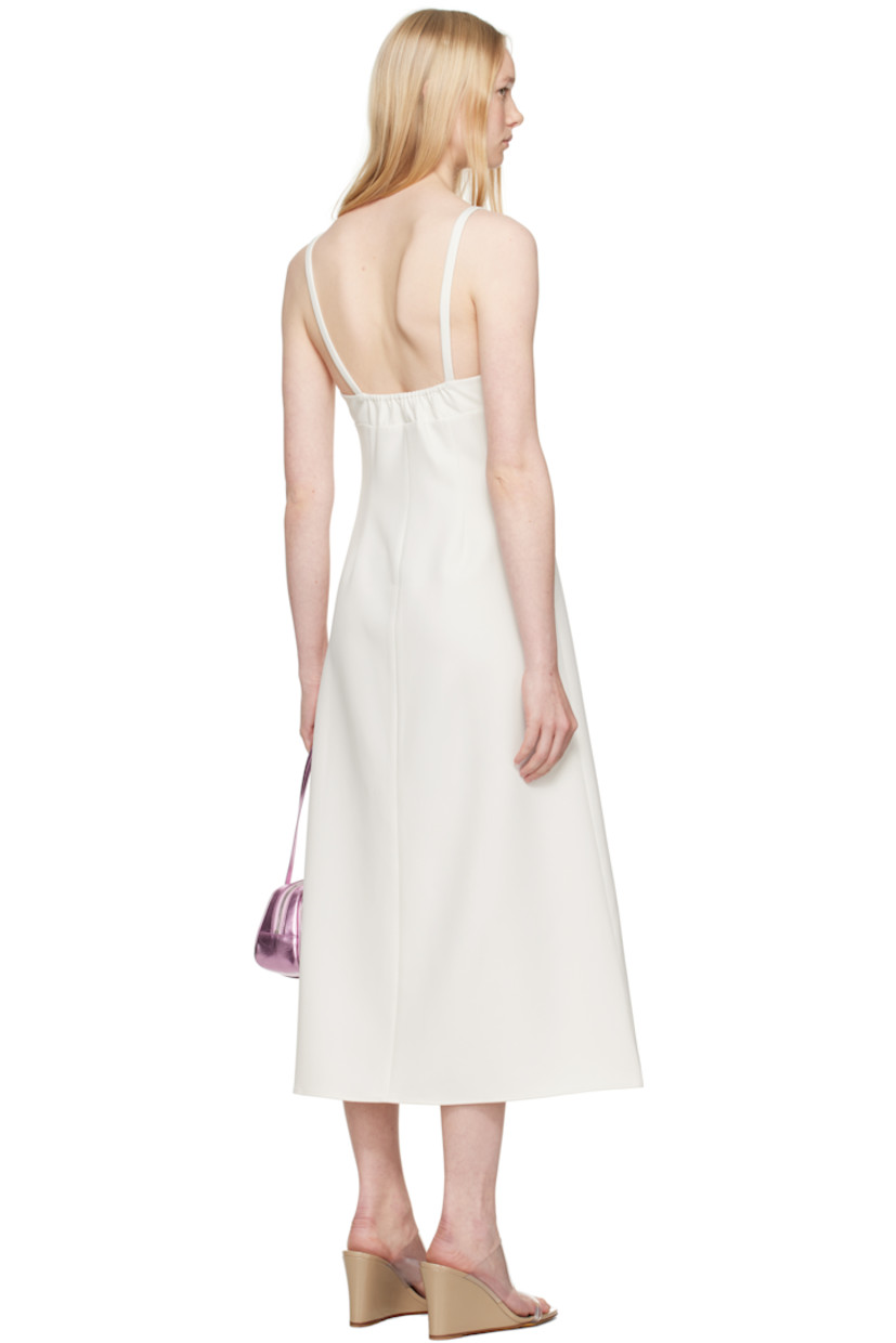 Stretch polyester broadcloth midi dress. 

· V-neck
· Floral appliqué at chest
· Darts at front
· Flared hem
· Concealed zip closure at side
· Elasticized trim at low back
· Partial viscose twill lining

Supplier color: Ivory