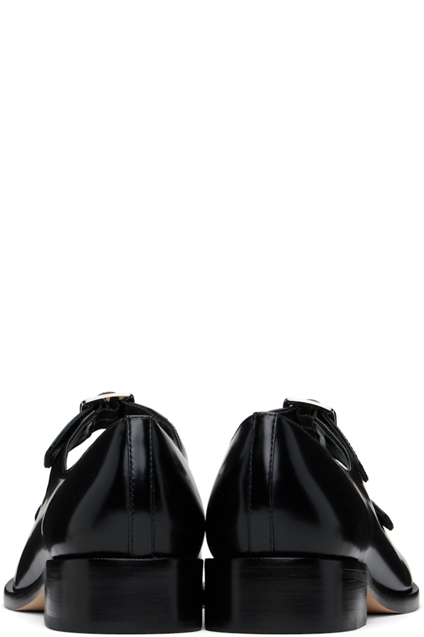 Spazzolato leather ballerina flats in black.

· Square toe
· Pin-buckle straps at vamp
· Logo patch at padded leather footbed
· Grained leather and suede lining
· Stacked leather heel with rubber injection
· Nubuck sole
· Heel: H1"

Supplier color: Black spazzolato