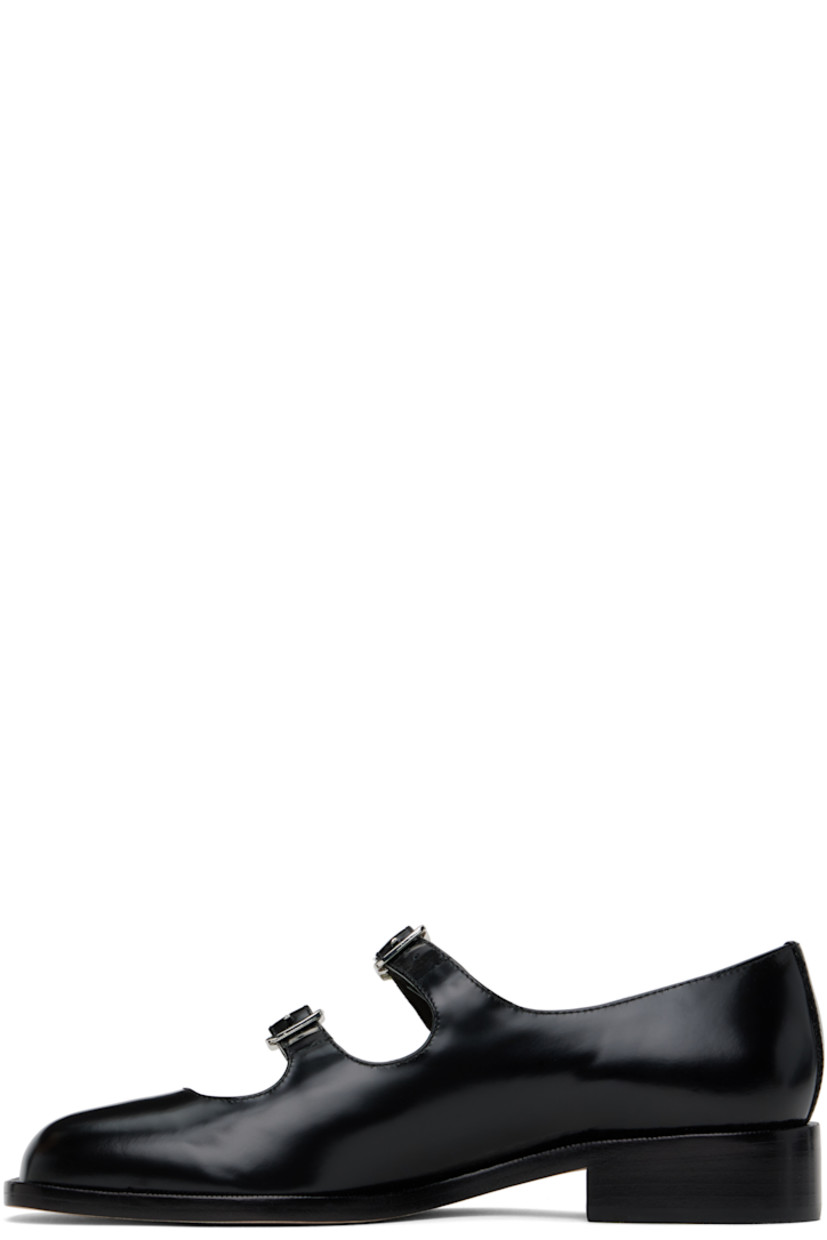 Spazzolato leather ballerina flats in black.

· Square toe
· Pin-buckle straps at vamp
· Logo patch at padded leather footbed
· Grained leather and suede lining
· Stacked leather heel with rubber injection
· Nubuck sole
· Heel: H1"

Supplier color: Black spazzolato