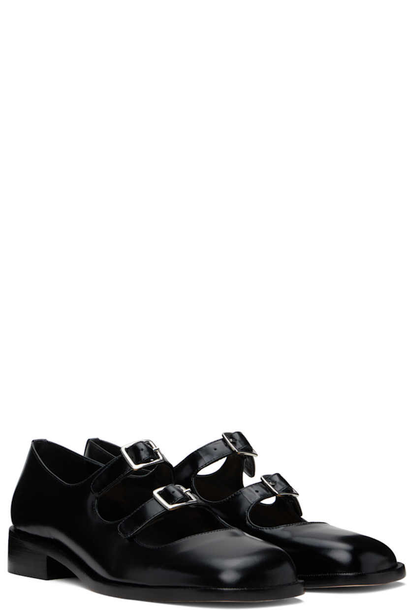 Spazzolato leather ballerina flats in black.

· Square toe
· Pin-buckle straps at vamp
· Logo patch at padded leather footbed
· Grained leather and suede lining
· Stacked leather heel with rubber injection
· Nubuck sole
· Heel: H1"

Supplier color: Black spazzolato