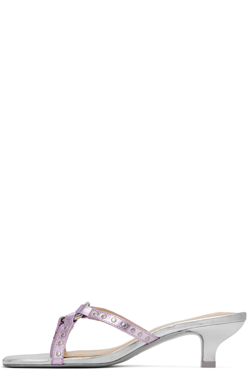 Grained leather heeled sandals in metallic silver tone and pink.

· Open square toe
· Thong-style strap at vamp
· O-ring and studded straps at vamp
· Logo patch at padded footbed
· Covered kitten heel with rubber injection
· Leather sole
· Heel: H1.75"

Supplier color: Metallic pink