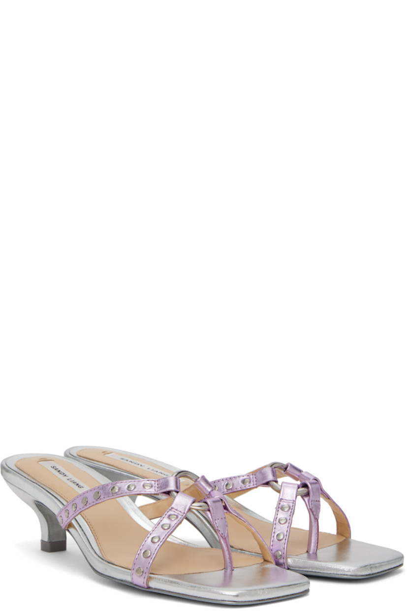 Grained leather heeled sandals in metallic silver tone and pink.

· Open square toe
· Thong-style strap at vamp
· O-ring and studded straps at vamp
· Logo patch at padded footbed
· Covered kitten heel with rubber injection
· Leather sole
· Heel: H1.75"

Supplier color: Metallic pink