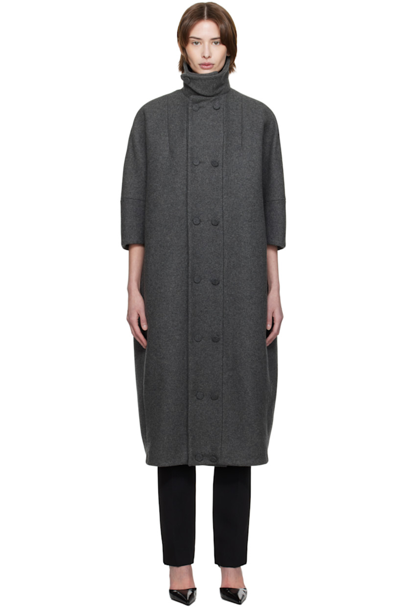 Wool melton coat.

· Button tab at modified spread collar
· Button closure
· Zip seam pockets
· Dolman sleeves
· Welt pockets at interior
· Full cotton lawn cloth lining
· Covered hardware

Supplier color: Grey wool melange