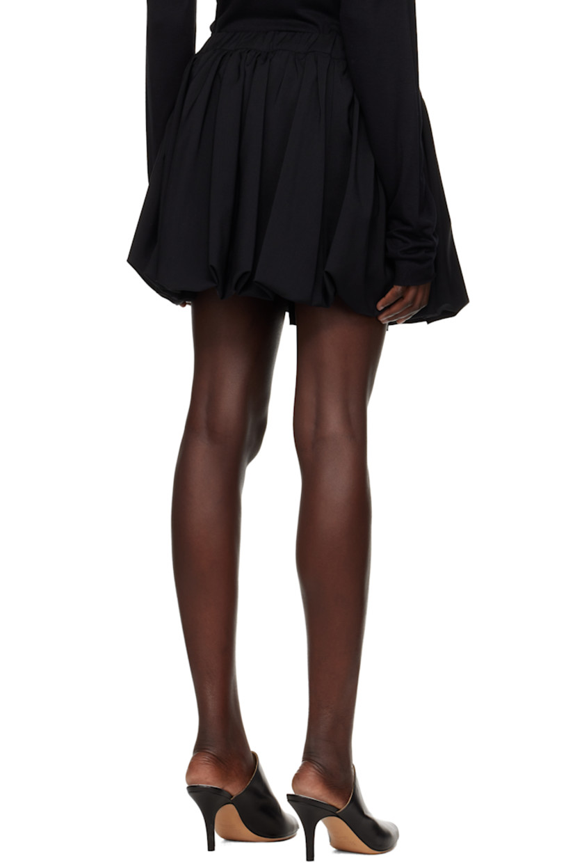 Plain-woven wool miniskirt. 

· Elasticized waistband
· Zip closure at side seam 
· Bubble hem 
· Full plain-woven cotton lining 

Supplier color: Black