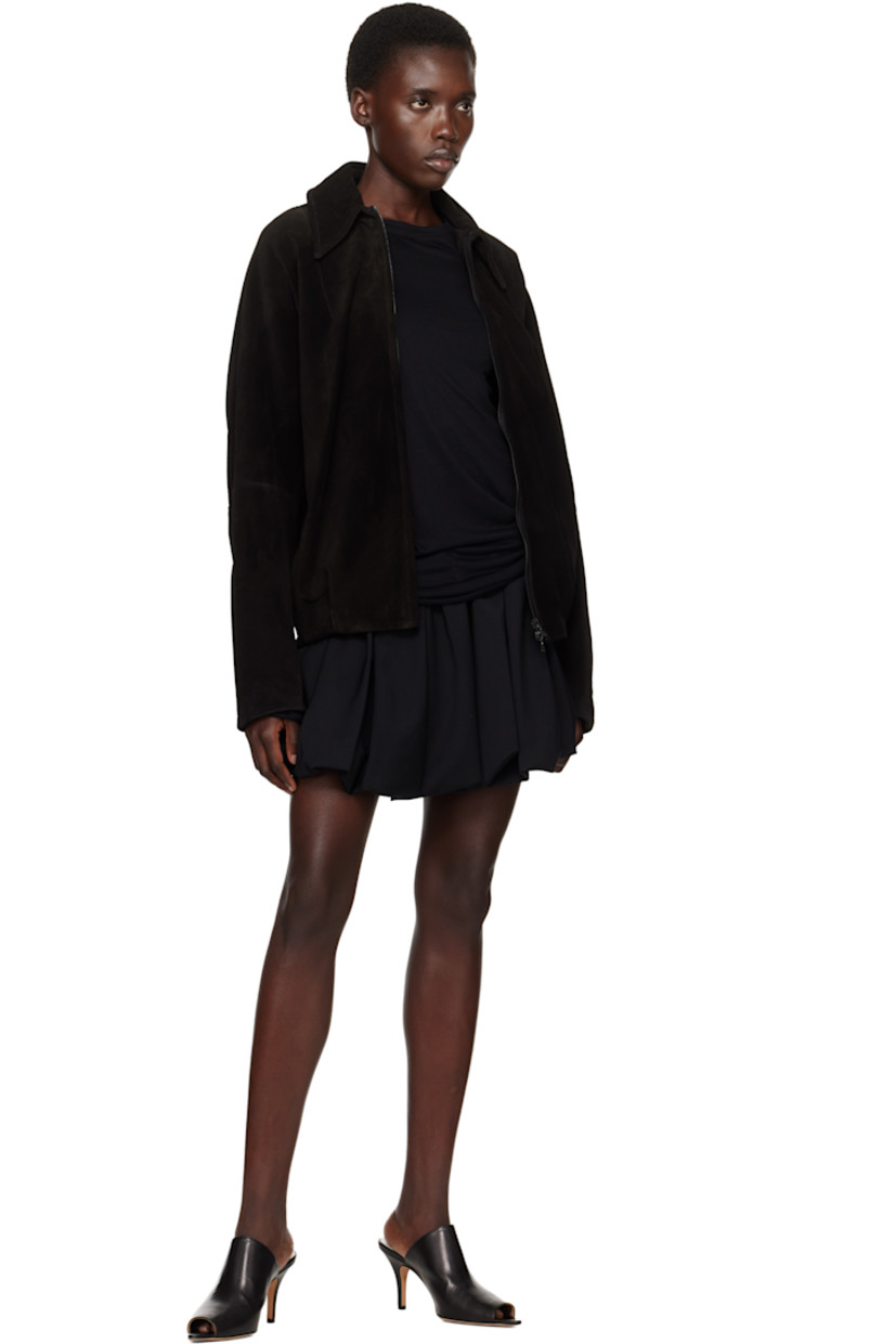 Plain-woven wool miniskirt. 

· Elasticized waistband
· Zip closure at side seam 
· Bubble hem 
· Full plain-woven cotton lining 

Supplier color: Black