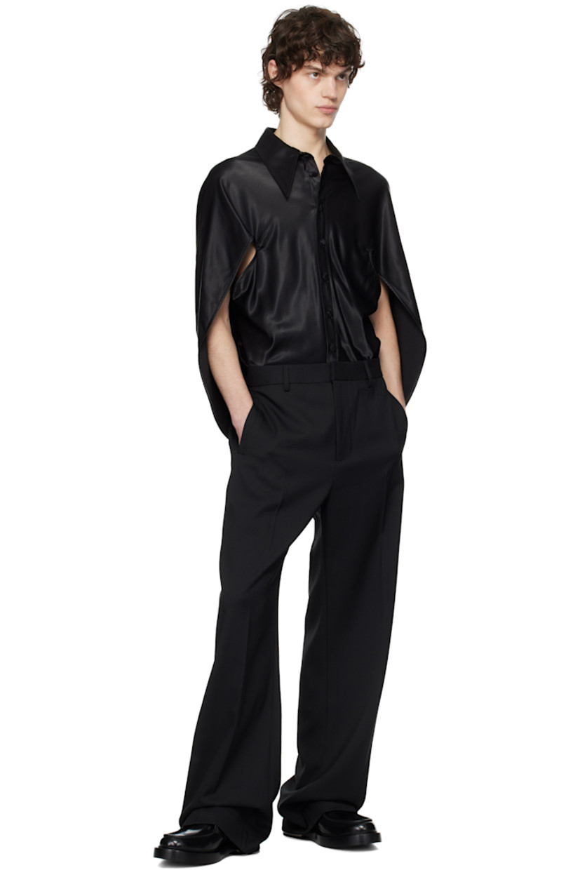 Viscose crêpe shirt.

· Pointed collar
· Button closure
· Modified sleeves with cutout
· Draping at back
· Crêpe-covered hardware

Supplier color: Black crepe