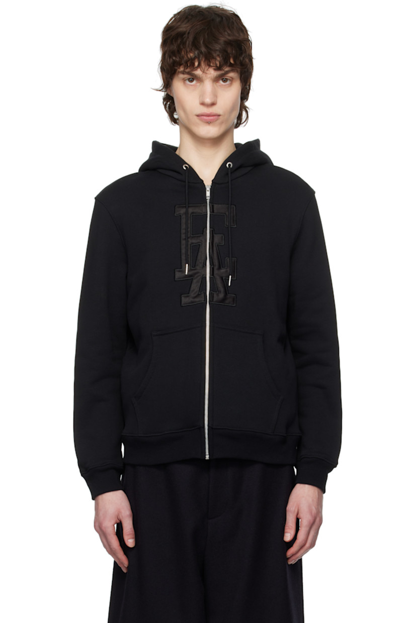 French terry hoodie.

· Drawstring at hood
· Zip closure
· Padded satin logo appliqué at front
· Patch pockets
· Rib-knit hem and cuffs

Supplier color: Black