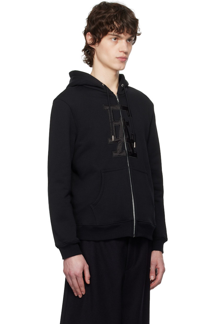French terry hoodie.

· Drawstring at hood
· Zip closure
· Padded satin logo appliqué at front
· Patch pockets
· Rib-knit hem and cuffs

Supplier color: Black