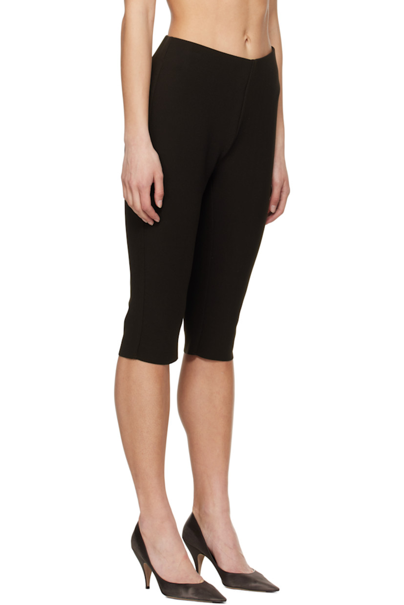 Double-faced stretch polyester bonded crêpe shorts. 

· Elasticized waistband
· Two-pocket styling
· Raw edge at cuffs

Supplier color: Chocolate