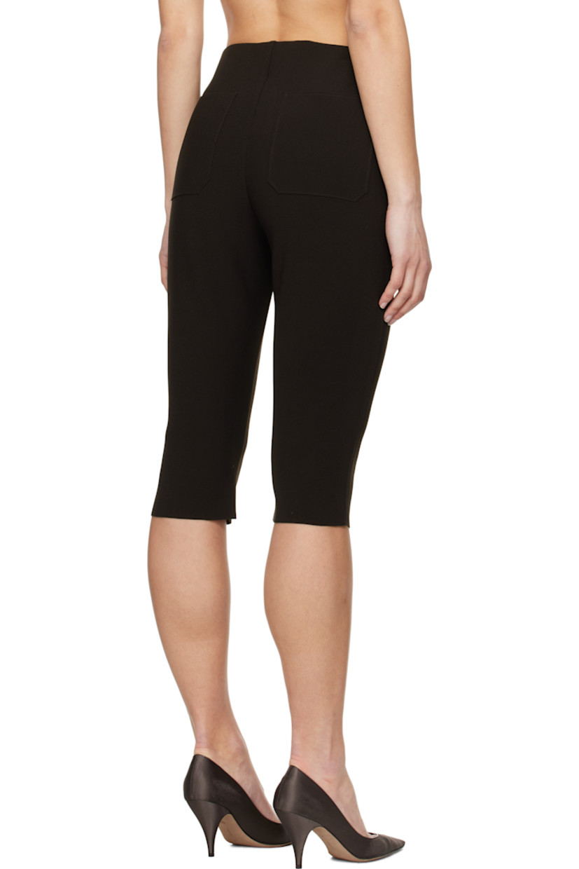 Double-faced stretch polyester bonded crêpe shorts. 

· Elasticized waistband
· Two-pocket styling
· Raw edge at cuffs

Supplier color: Chocolate