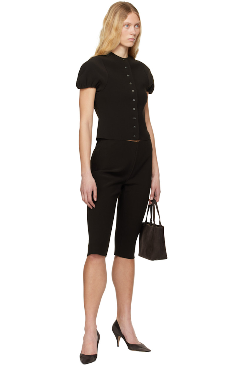 Double-faced stretch polyester bonded crêpe shorts. 

· Elasticized waistband
· Two-pocket styling
· Raw edge at cuffs

Supplier color: Chocolate