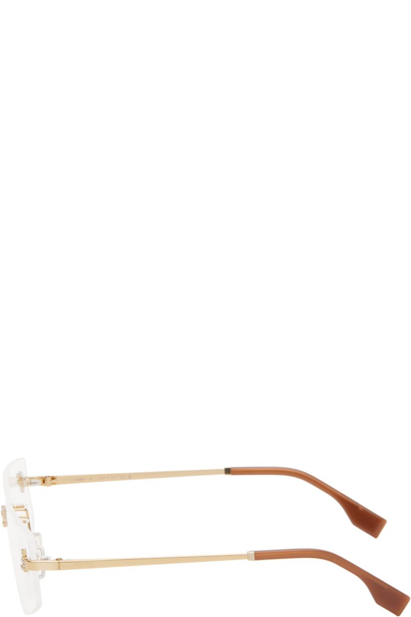 Cat-eye rimless metal-frame optical glasses in gold tone. 

· Adjustable rubber nose pads
· Crystal-cut logo at face 
· Logo embossed at temples
· Acetate temple tips in brown
· Includes pouch 
· Size: 58.12 135 

Supplier color: Shiny endura gold
