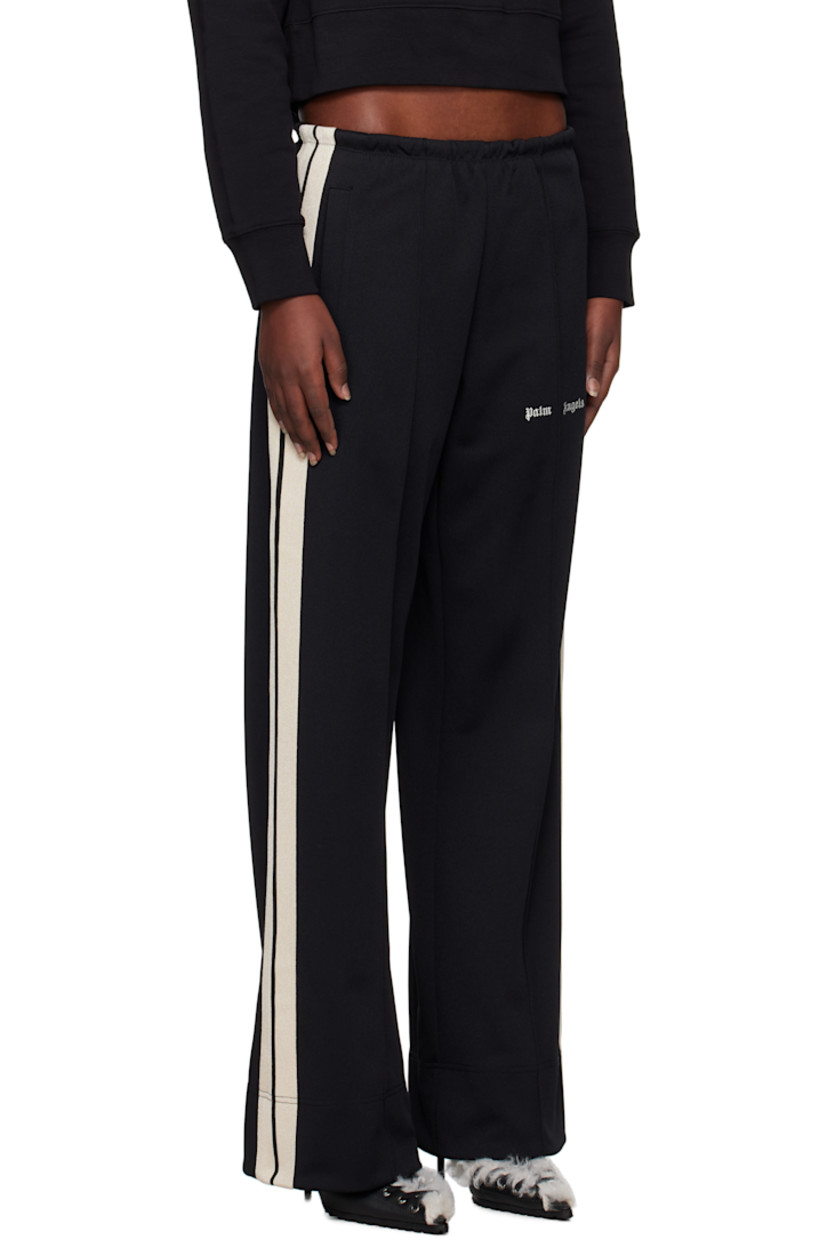 Polyester interlock jersey track pants.

· Elasticized waistband
· Two-pocket styling
· Logo embroidered at leg
· Pinched seam at legs
· Striped trim at outseams

Supplier color: Black/Off-White