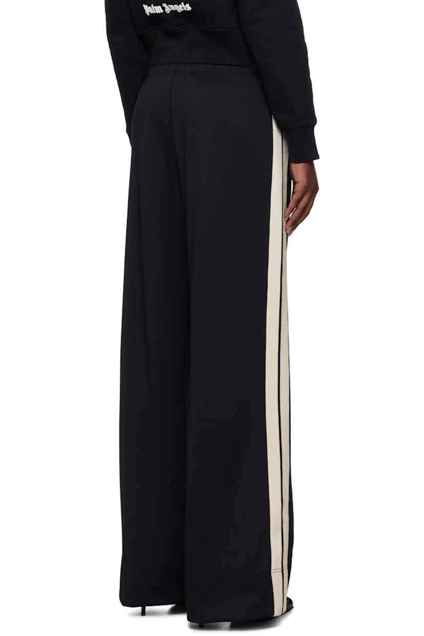 Polyester interlock jersey track pants.

· Elasticized waistband
· Two-pocket styling
· Logo embroidered at leg
· Pinched seam at legs
· Striped trim at outseams

Supplier color: Black/Off-White