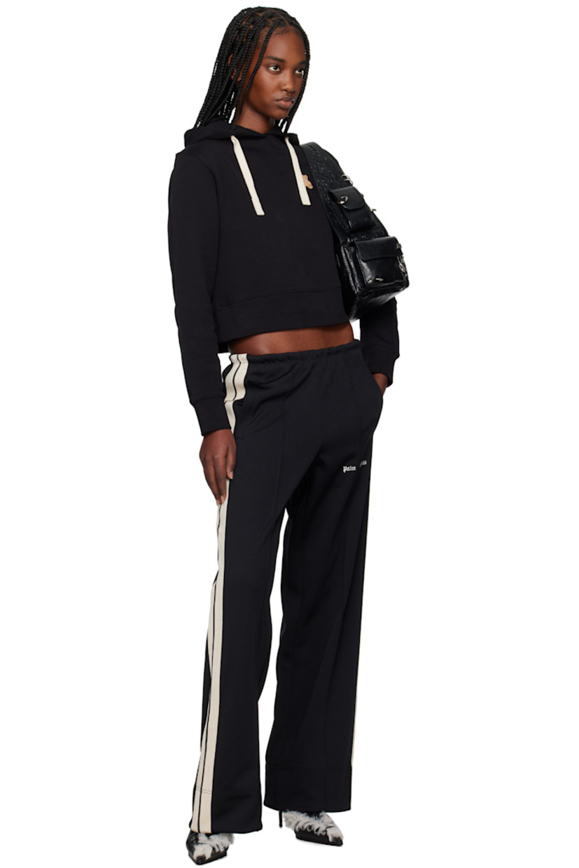 Polyester interlock jersey track pants.

· Elasticized waistband
· Two-pocket styling
· Logo embroidered at leg
· Pinched seam at legs
· Striped trim at outseams

Supplier color: Black/Off-White