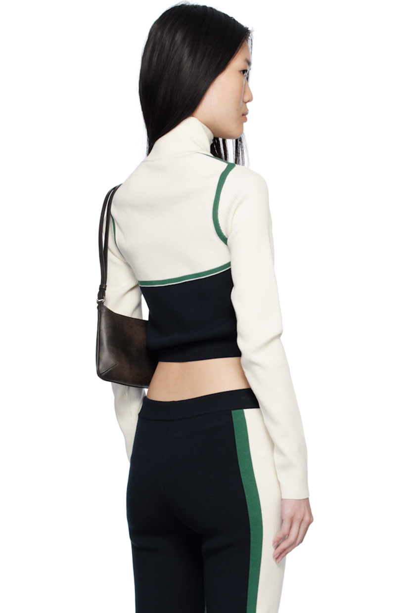 Rib-knit viscose-blend jacket.

· Turtleneck
· Zip closure
· Jacquard logo at chest
· Cropped hem
· Raglan sleeves

Supplier color: Navy blue/Off white