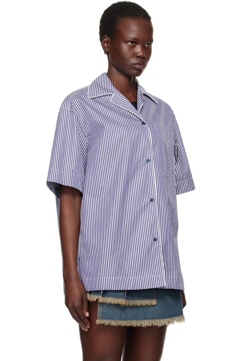Cotton twill shirt. Jacquard stripe pattern throughout.

· Open spread collar
· Button closure
· Logo flag at patch pocket 
· Logo printed at back hem

Supplier color: Navy blue