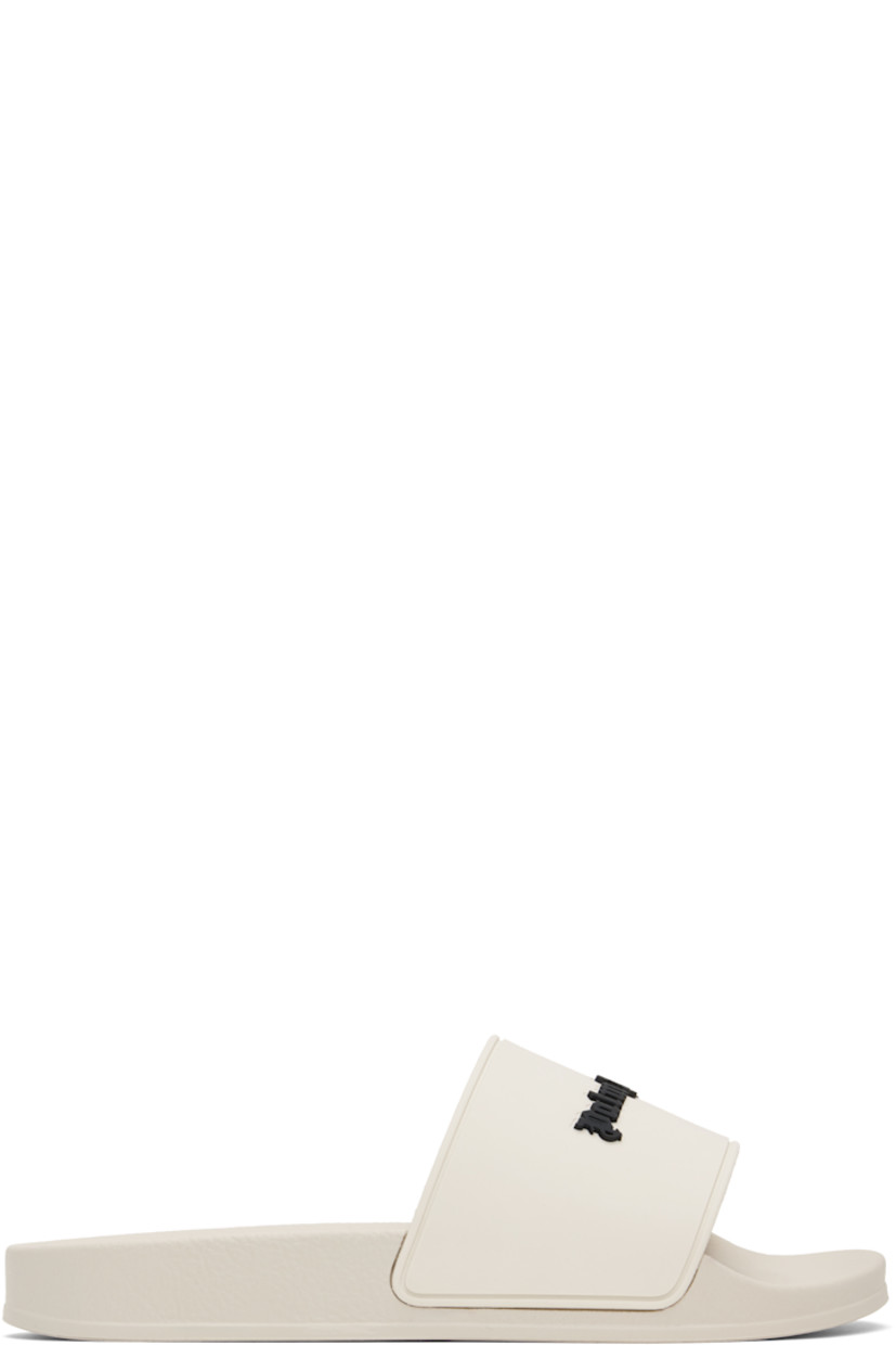Rubber pool slides in beige.

· Open toe
· Logo embossed at vamp
· Logo embossed at molded footbed
· Treaded rubber sole

Supplier color: Beige/Black