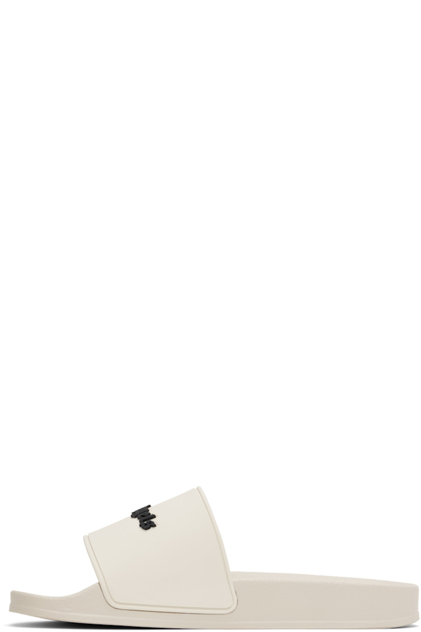 Rubber pool slides in beige.

· Open toe
· Logo embossed at vamp
· Logo embossed at molded footbed
· Treaded rubber sole

Supplier color: Beige/Black