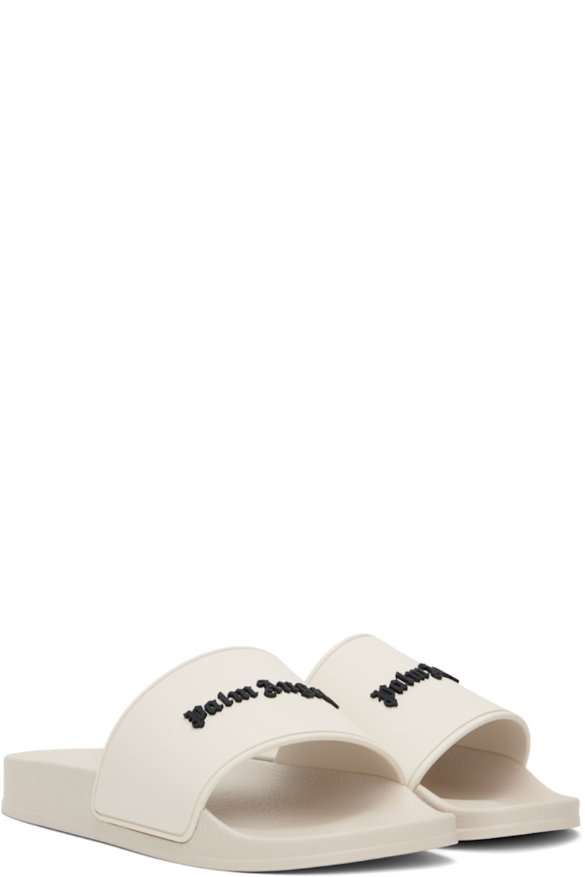 Rubber pool slides in beige.

· Open toe
· Logo embossed at vamp
· Logo embossed at molded footbed
· Treaded rubber sole

Supplier color: Beige/Black