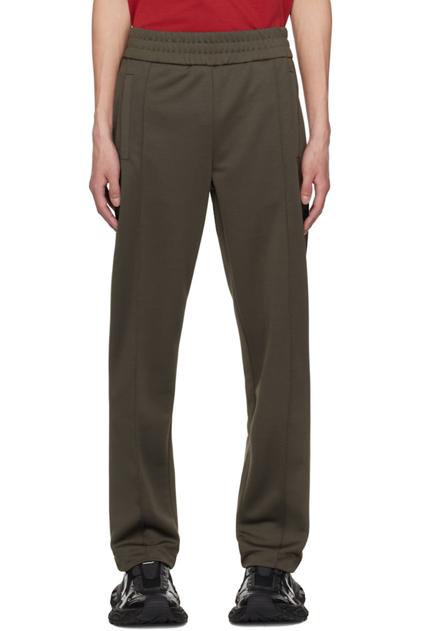 Polyester jersey track pants.

· Elasticized waistband
· Two-pocket styling
· Pinched seams at front 
· Logo bonded at back

Supplier color: Vintage black/Off-white
