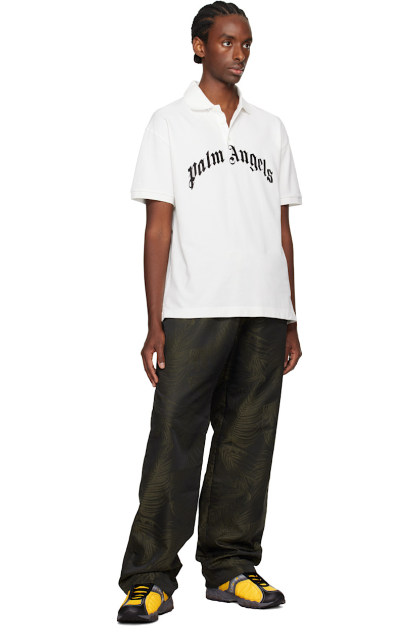 Polyester- and wool-blend sateen lounge pants. Jacquard graphic pattern throughout.

· Drawstring at elasticized waistband
· Four-pocket styling

Supplier color: Military green