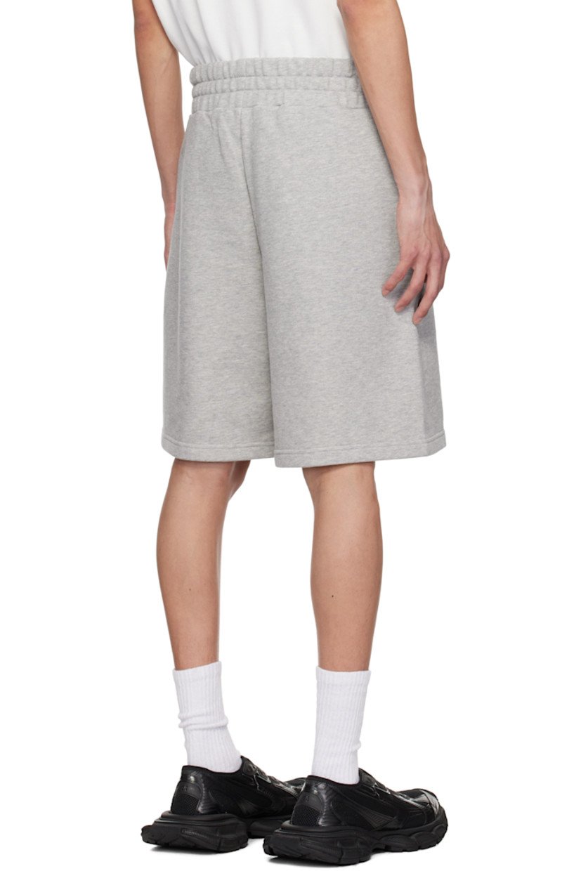 French terry shorts.

· Elasticized waistband
· Two-pocket styling
· Logo and graphic bonded at front 

Supplier color: Grey melange