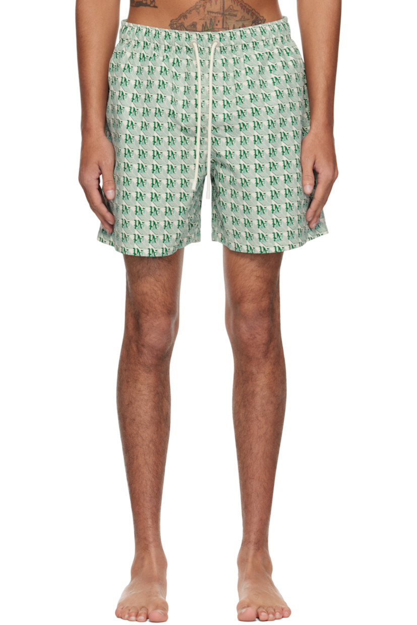 Polyester taffeta swim shorts. Logo graphic pattern printed throughout.

· Drawstring at elasticized waistband
· Three-pocket styling
· Logo flag and eyelet vent at back pocket
· Partial mesh lining

Supplier color: Green/Ivory